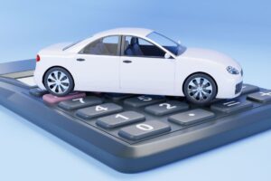 auto in miniatura e calcolatrice