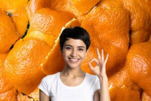 Donna ok, bucce arancia dietro di lei